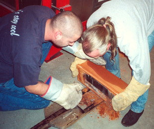 hot glass casting_removing glass from the mold for annealing